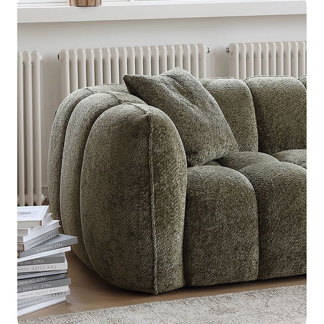 Detail view of Winslow Pumpin Two Seater, Three Seater Sofa, Boucle with dining room table with couch
