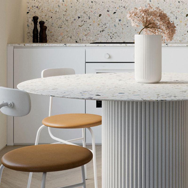 Cracky White Round Dining Table, Premium Terrazzo And Wood Base in a lifestyle setting with circular extending dining table