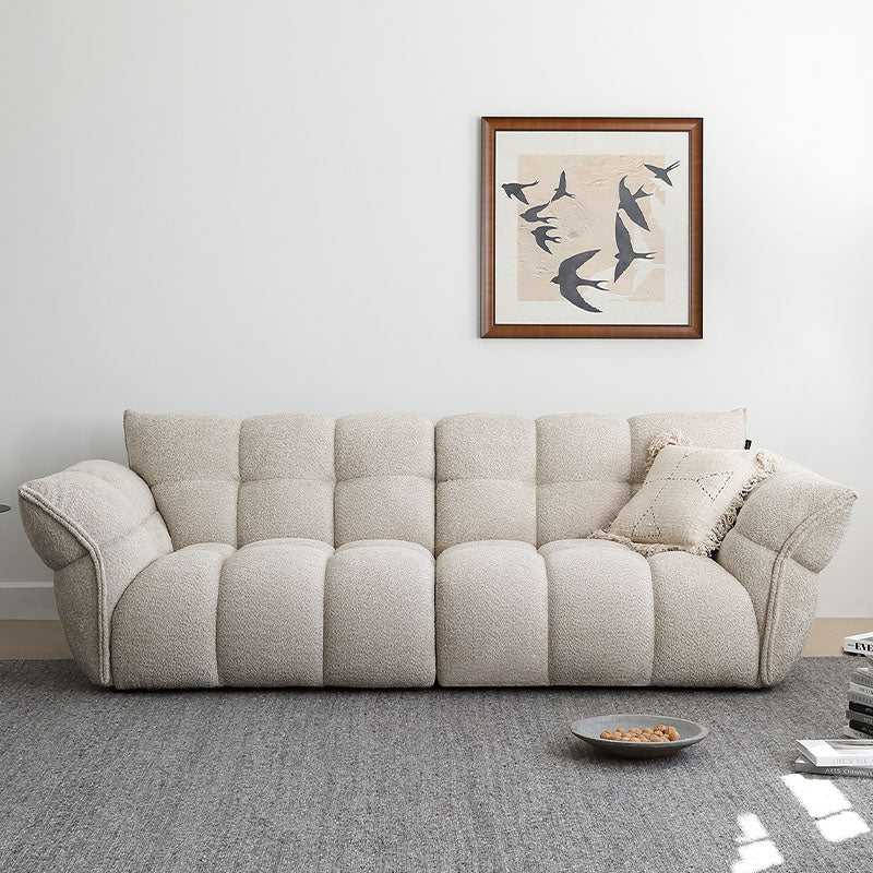 Detail view of Tristin Two Seater, Three Seater Sofa, Boucle with circle dining room table