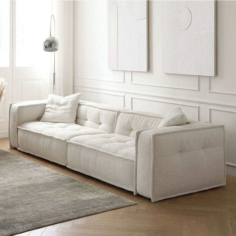Undra Two Seater, Three Seater Sofa, Boucle in a lifestyle setting with wooden dining table with chairs