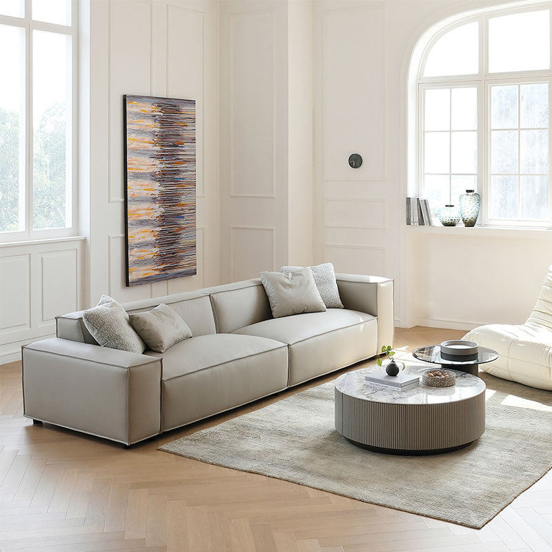 Ximenes Two Seater Sofa, Leathaire in a lifestyle setting with round dining room tables
