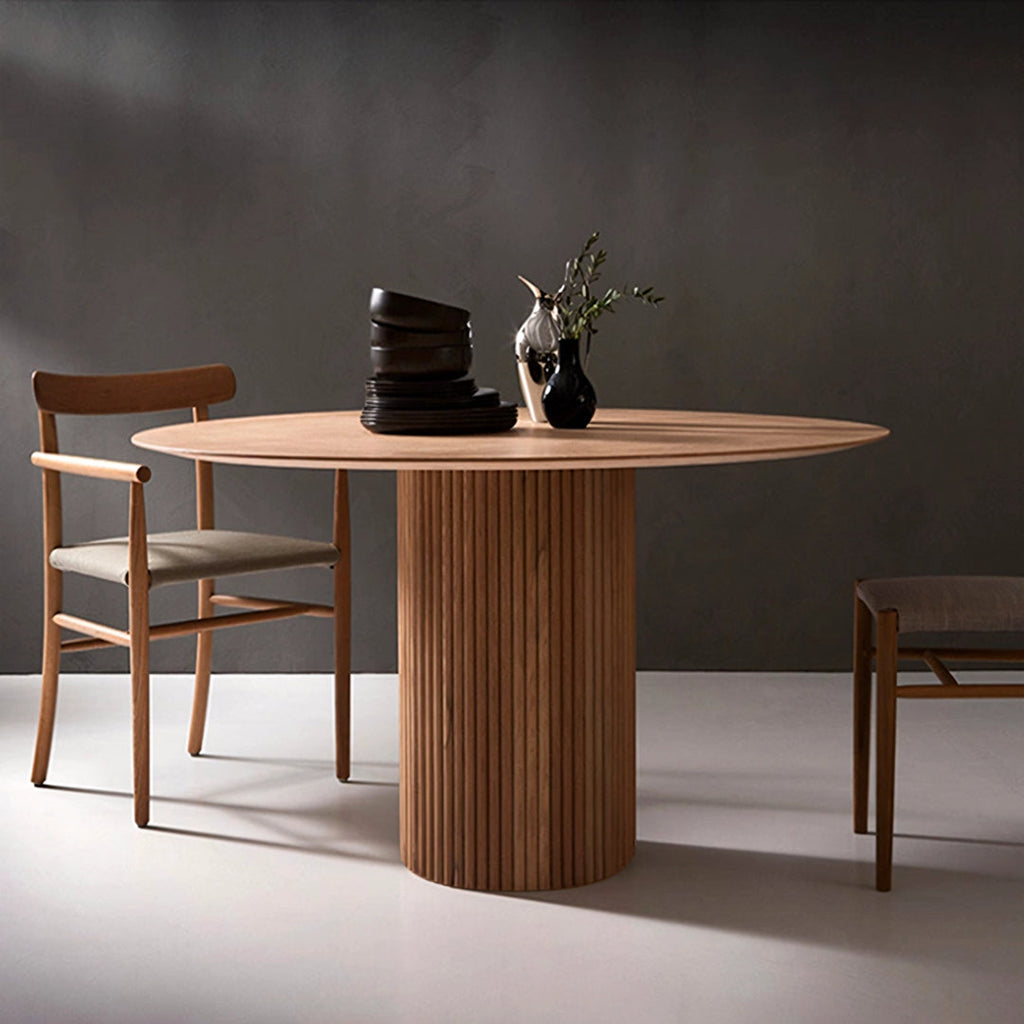 Ivar Round Dining Table, Oak Or Walnut in a lifestyle setting with table and 4 chairs dining