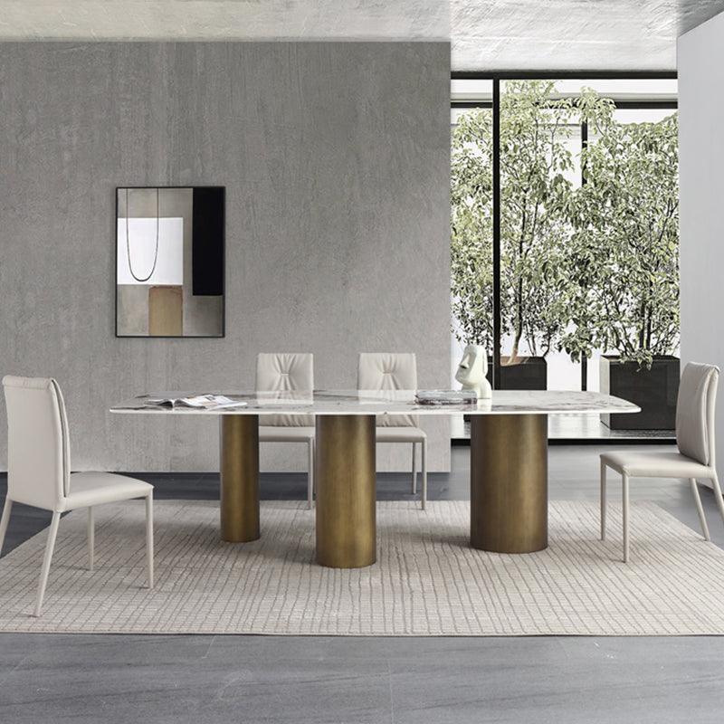 Detail view of Mira Dining Table, Gold Base with table decorations for dining table