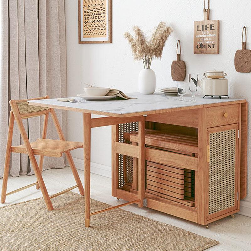 Nydia Foldable Dining Table Set With Storage, Rattan, Solid Wood in a lifestyle setting with small dining table for 4