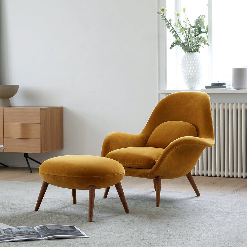 Fredericia Swoon Armchair And Footstool, Velvet, side view of oak sideboard