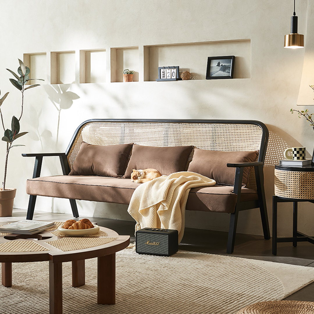 Detail view of Morris Casual Rattan Armchair with dining room tables round pedestal