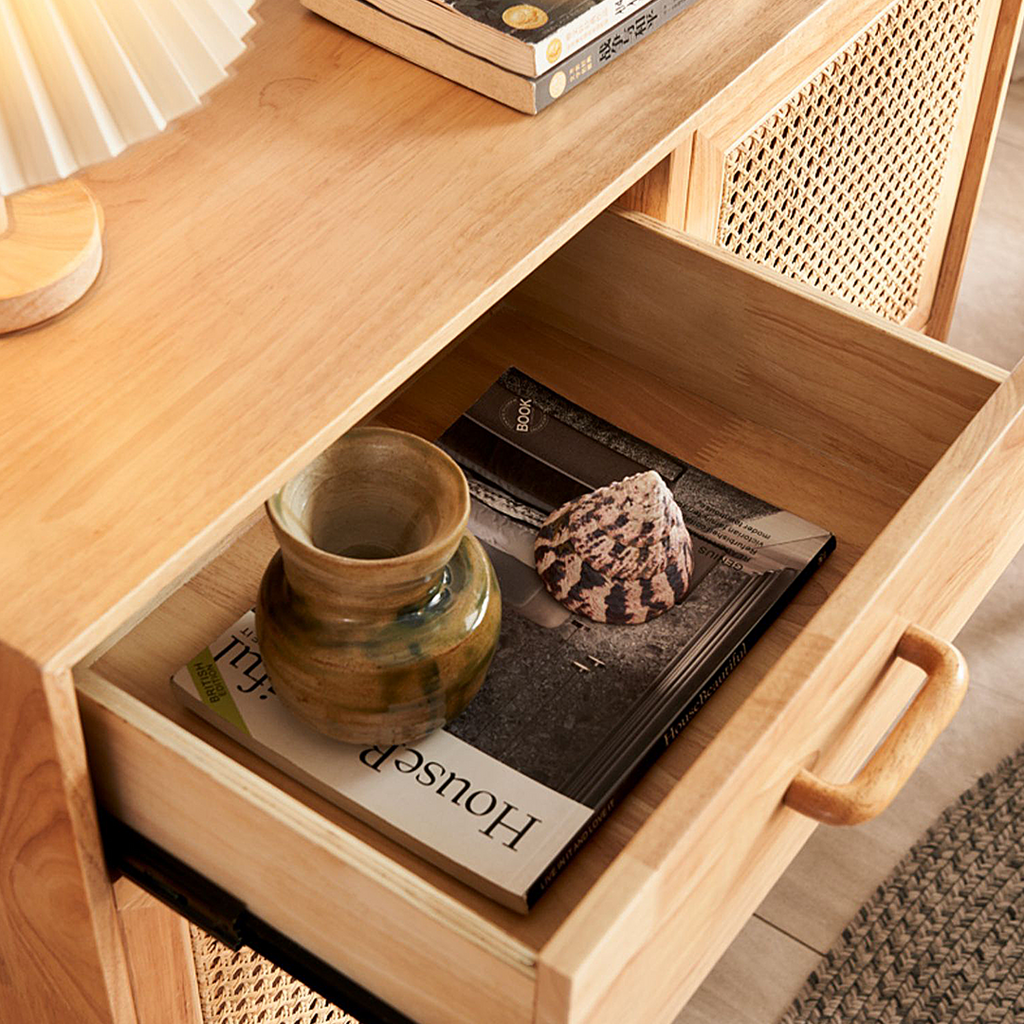 Detail view of Madeline Rattan Sideboard, Small with navy blue sideboard
