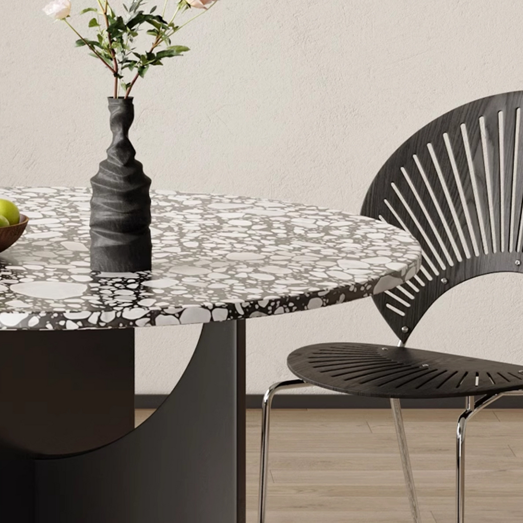 Detail view of Oighrig Terrazzo Round Dining Table with dining table seat cushions