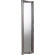Tall, narrow mirror with decorative silver frame on a white background Iconic abode