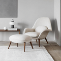 Detail view of Fredericia Swoon Armchair And Footstool, Velvet with black sideboard