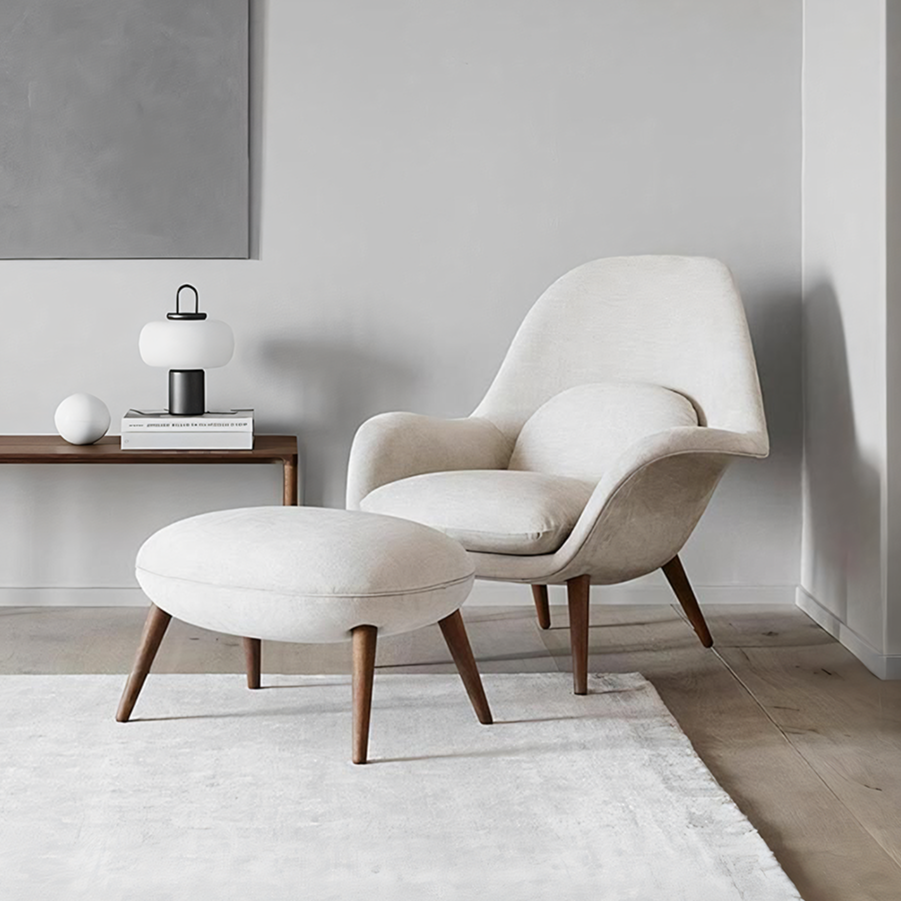 Detail view of Fredericia Swoon Armchair And Footstool, Velvet with black sideboard