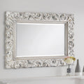 Decorative silver mirror with intricate patterns Iconic abode