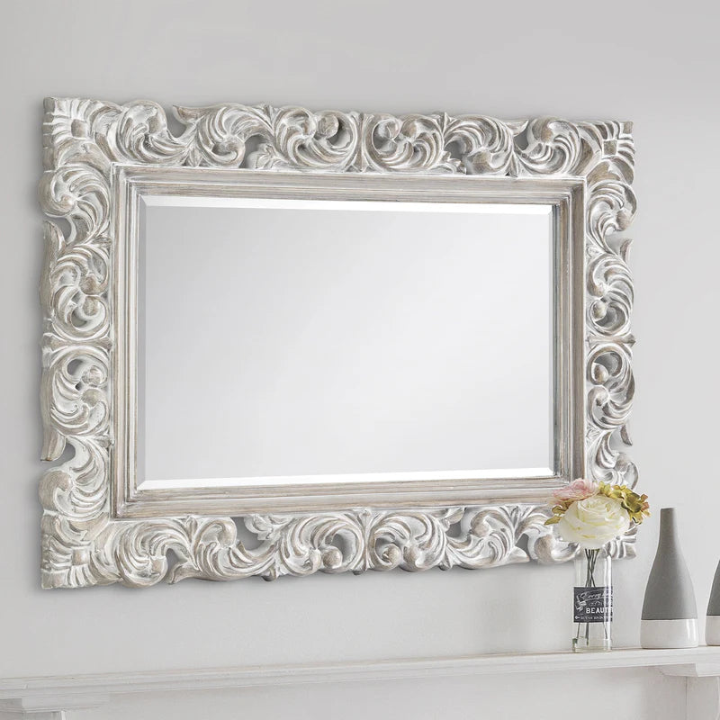 Decorative silver mirror with intricate patterns Iconic abode