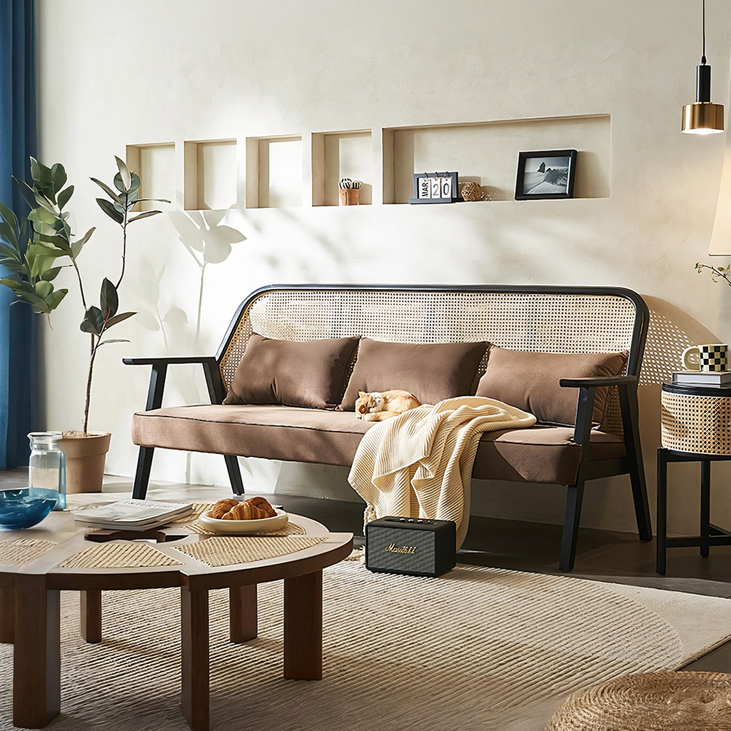 Detail view of Morris Rattan Two Seater, Three Seater Sofa with glass top dining room table
