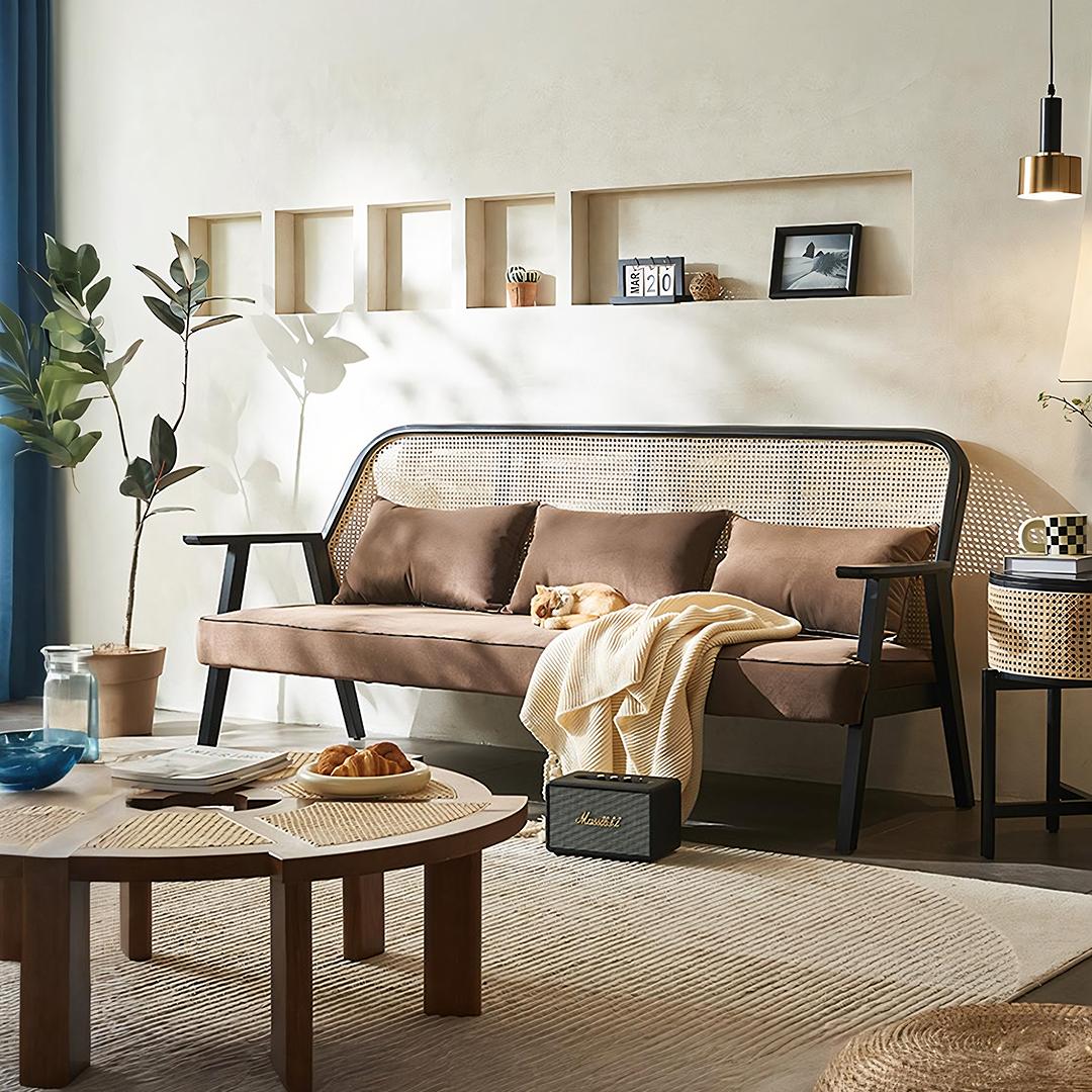 Detail view of Morris Rattan Two Seater, Three Seater Sofa with glass top dining room table