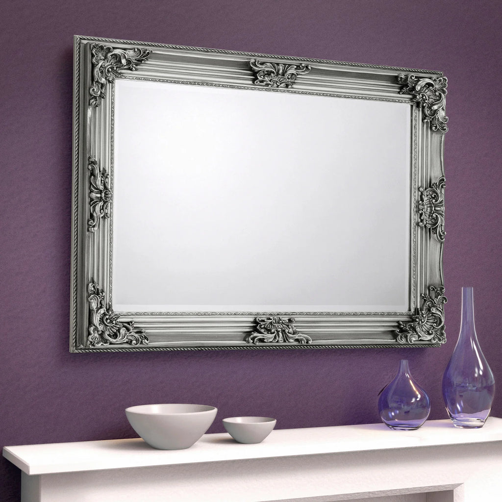 Decorative silver mirror with intricate designs iconic abode