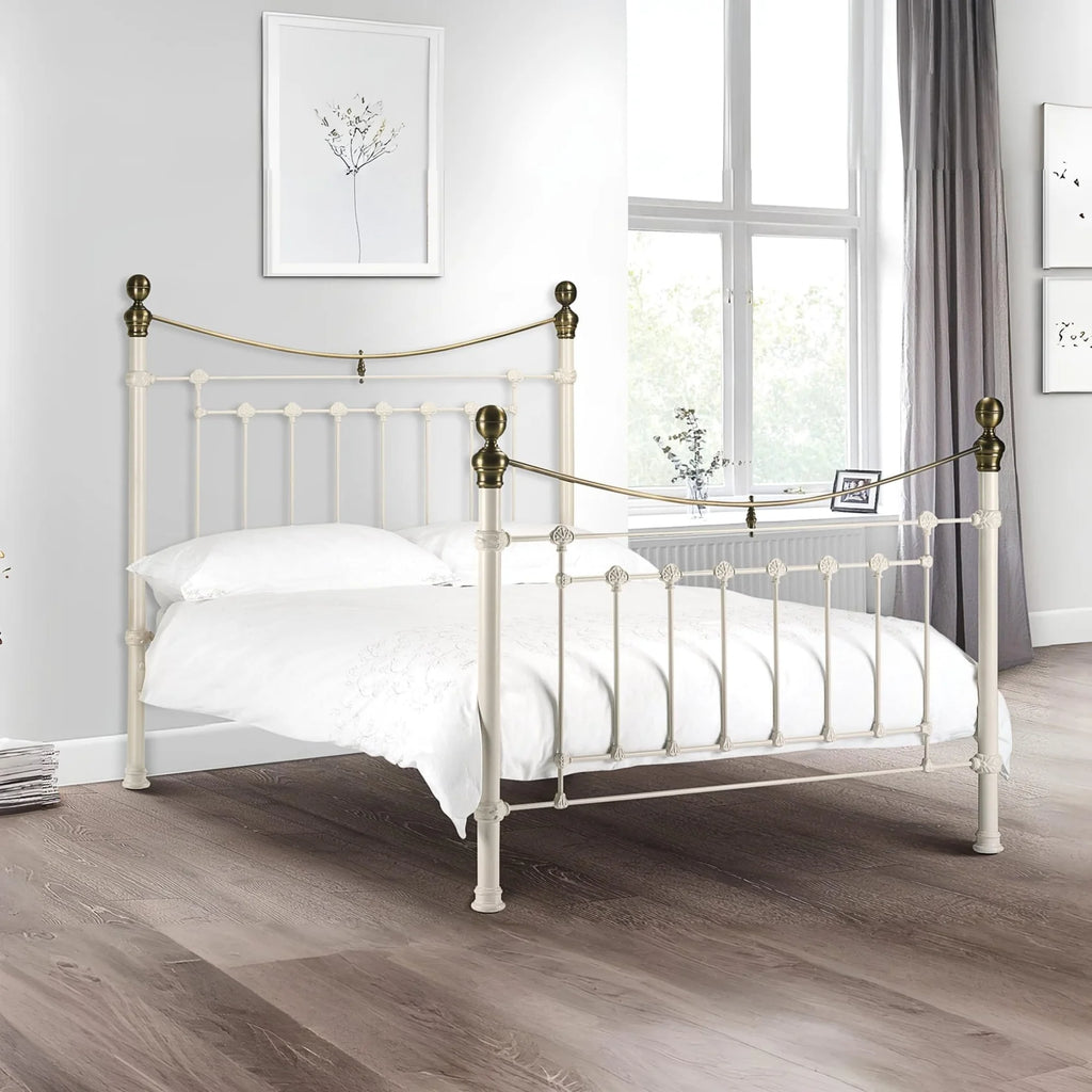 White metal bed with brass accents iconic abode