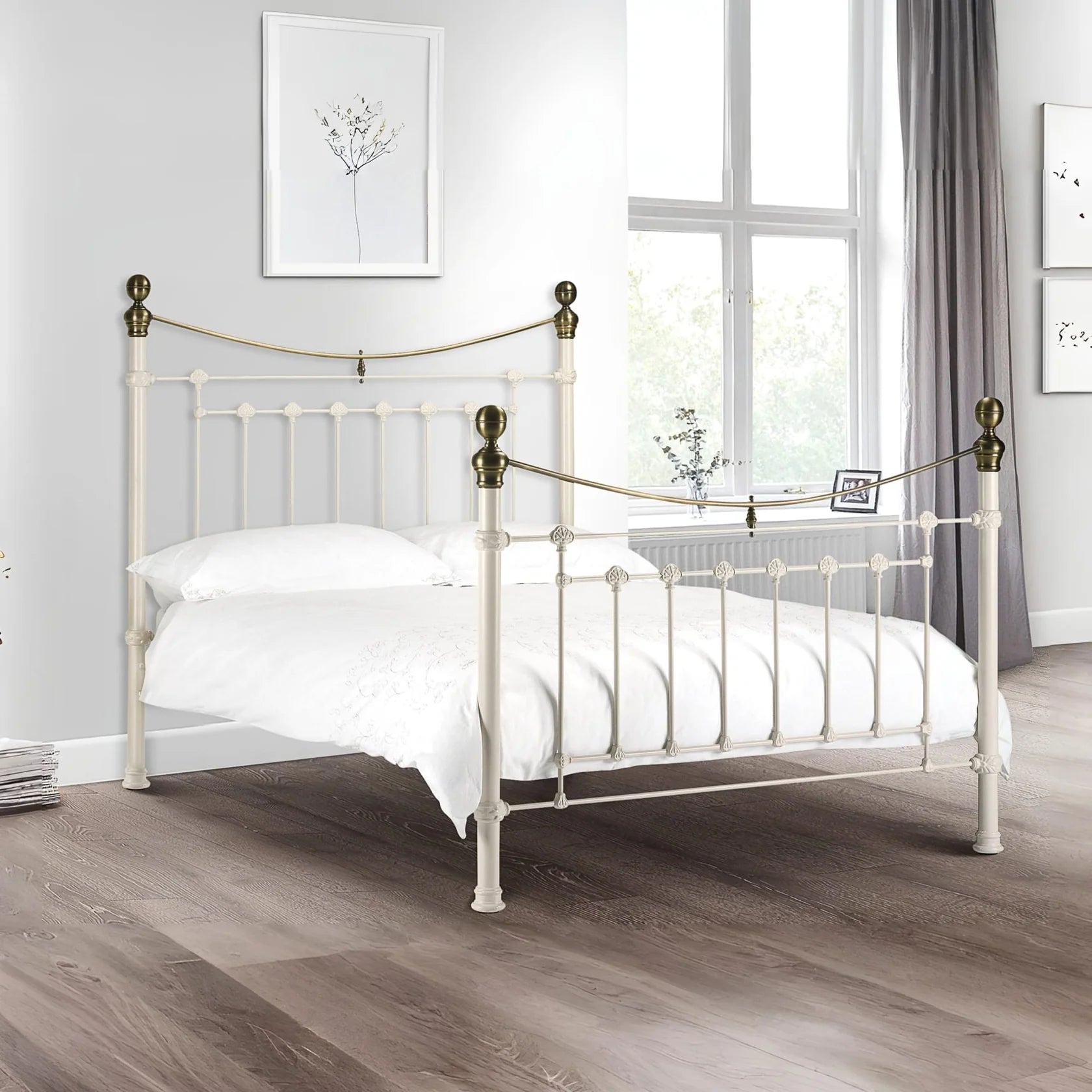 White metal bed with brass accents iconic abode