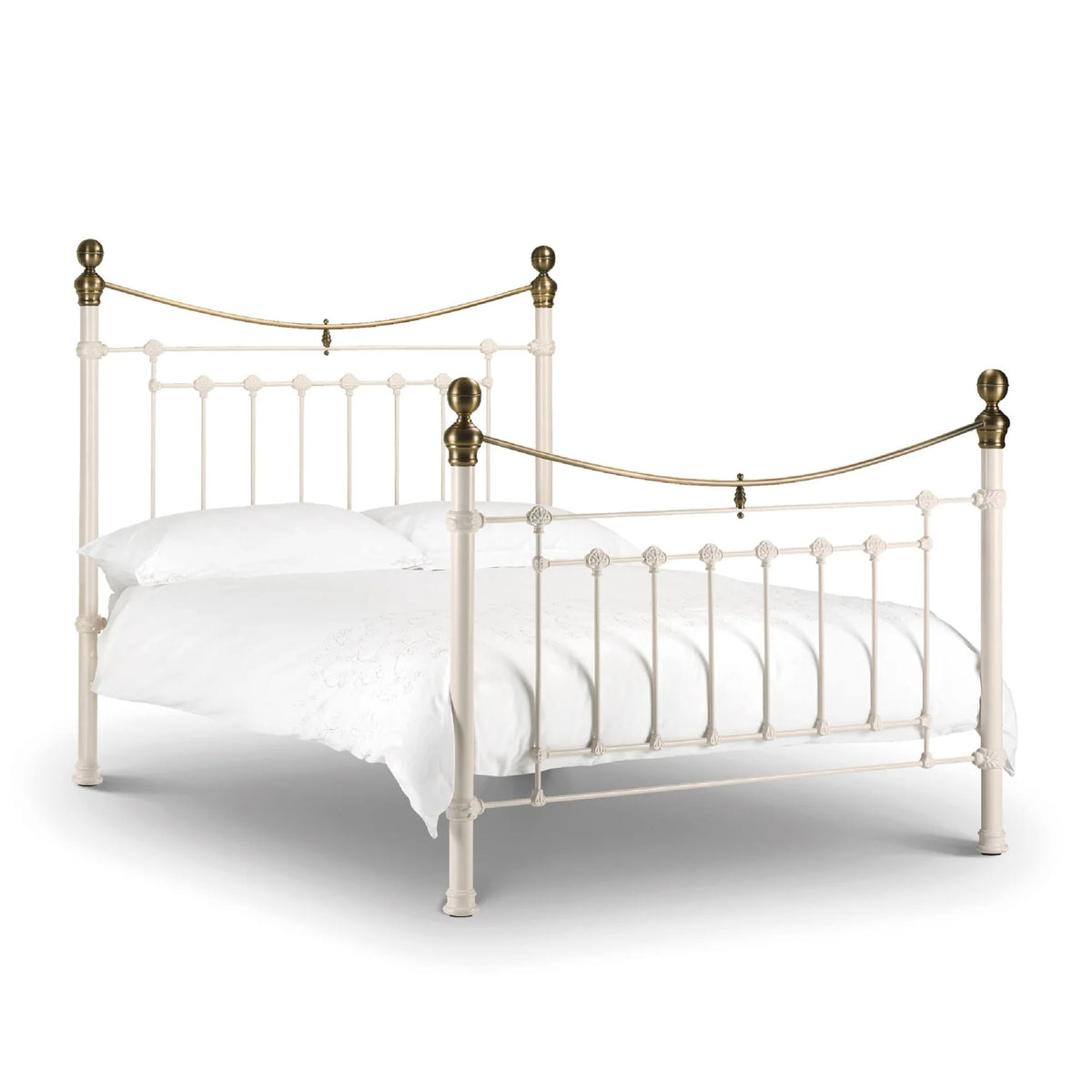 White metal bed with brass accents iconic abode