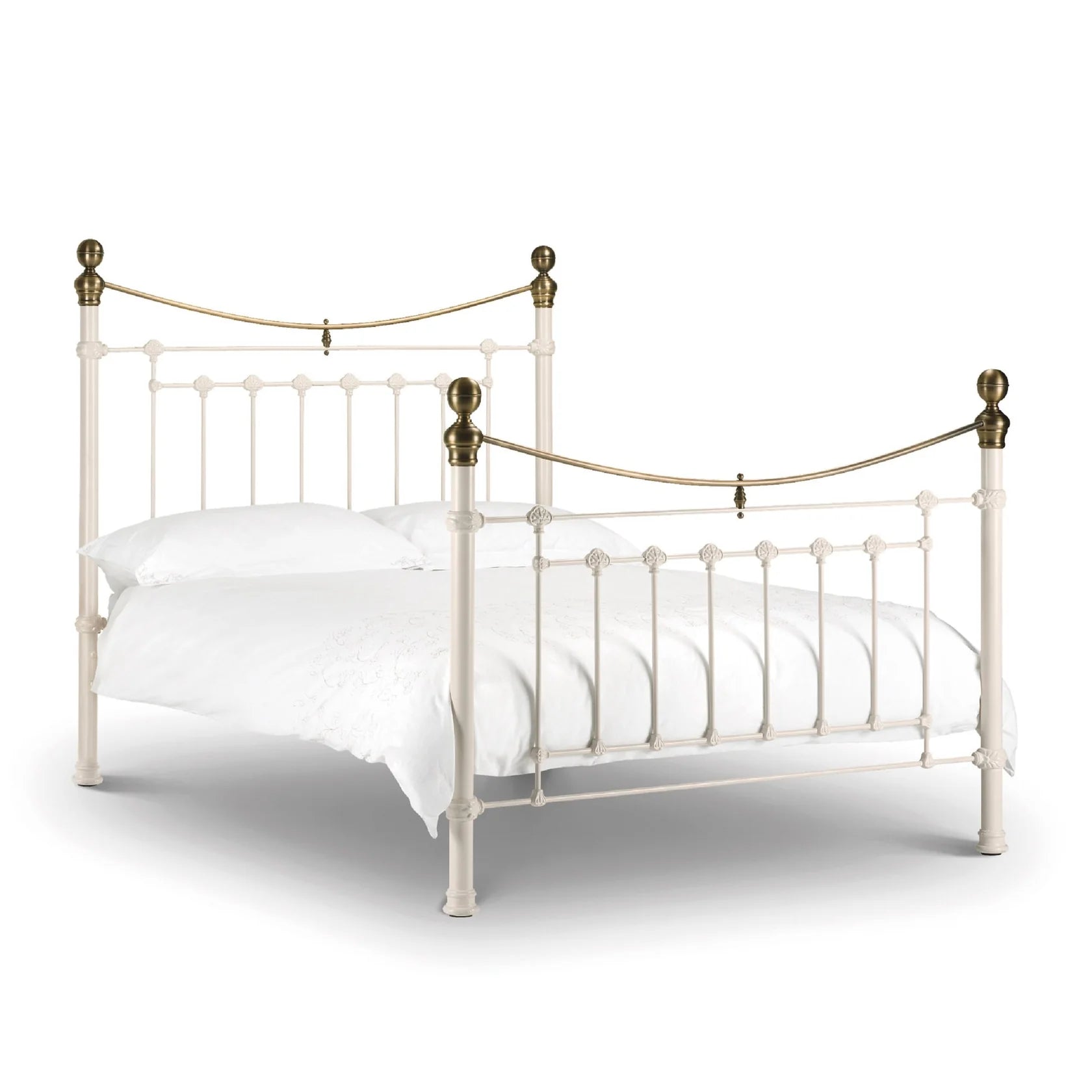 White metal bed with brass accents iconic abode