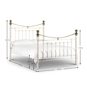 White metal bed with brass accents iconic abode