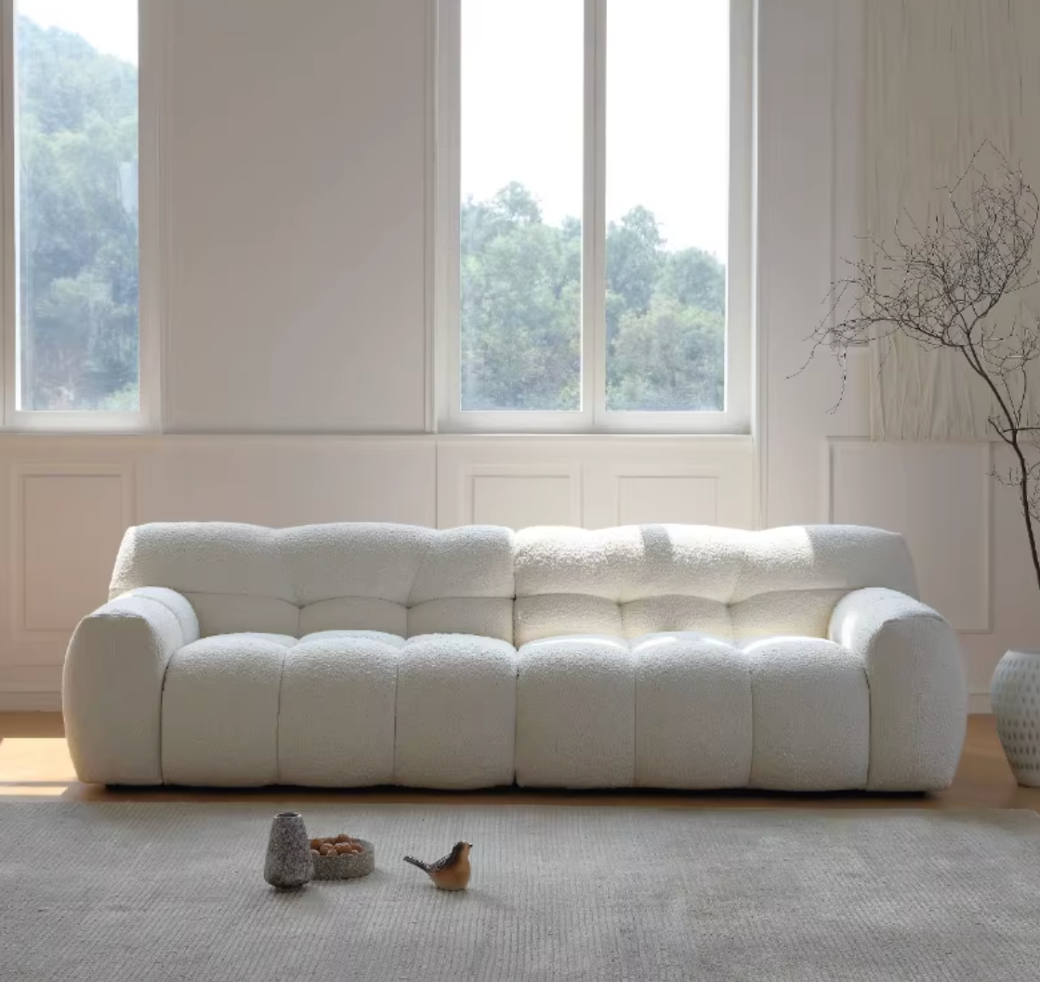 Detail view of Cora Cloud Two / Three Seater Sofa, Boucle with outdoor foldable dining table