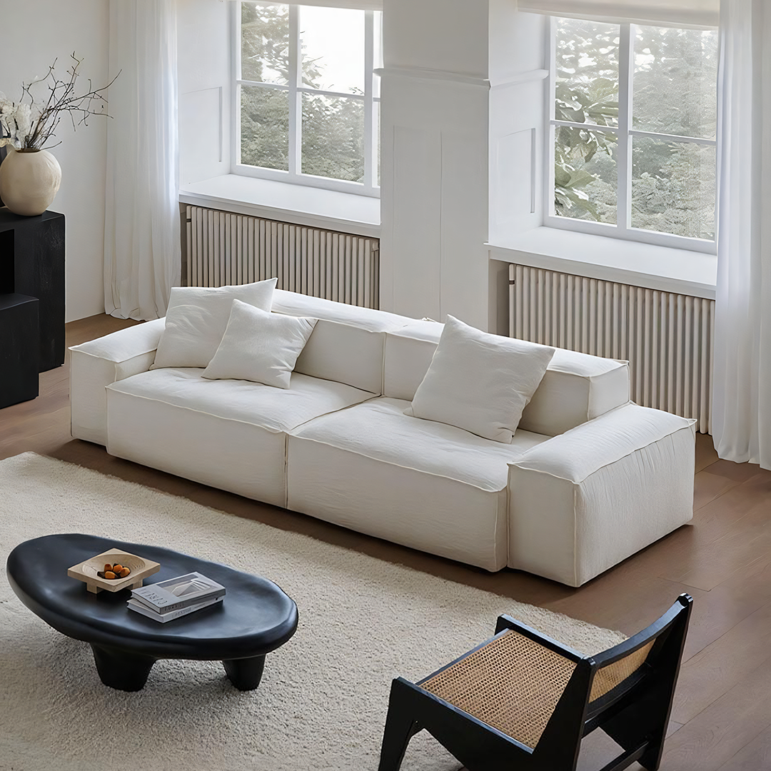 Zaavan Three Seater Sofa, Modular Sofa, White Linen, side view of expandable round dining table