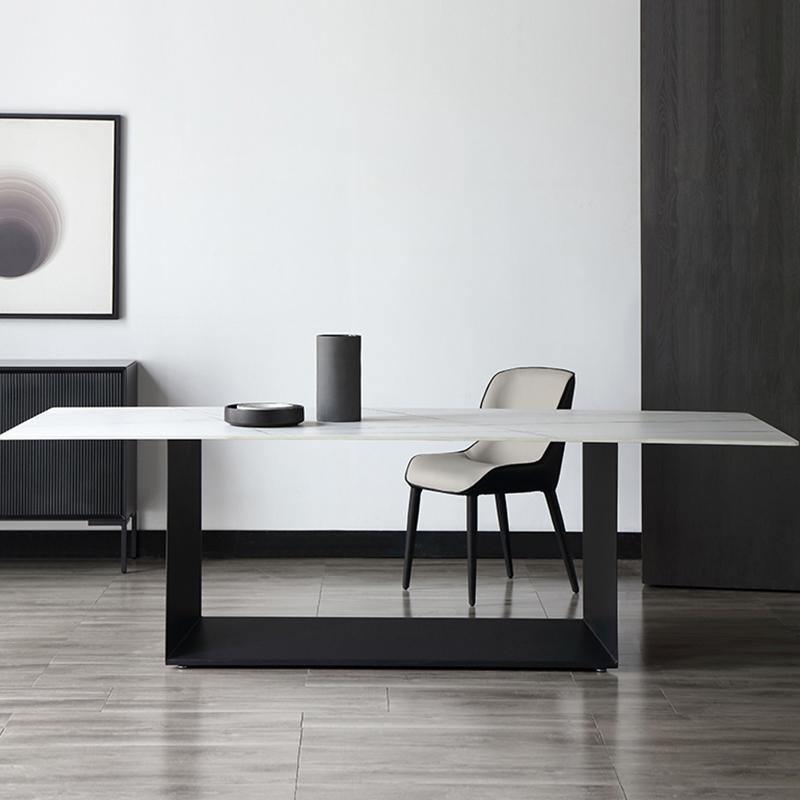 Alme Dining Table, Black Base in a lifestyle setting with round patio dining table and chairs