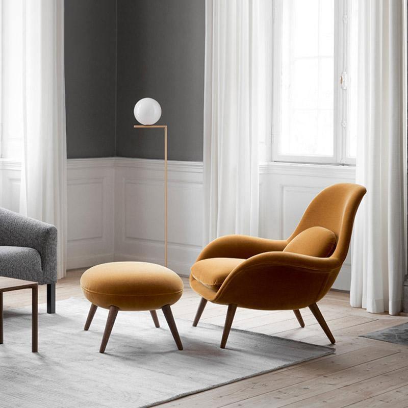 Fredericia Swoon Armchair And Footstool, Velvet in a lifestyle setting with white sideboard