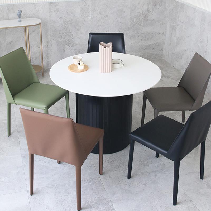 Detail view of Barbican Round Dining Table with round dining table set for 4