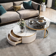 Detail view of Bell Nesting Coffee Table Set, White & Gold with dining room table seats 10