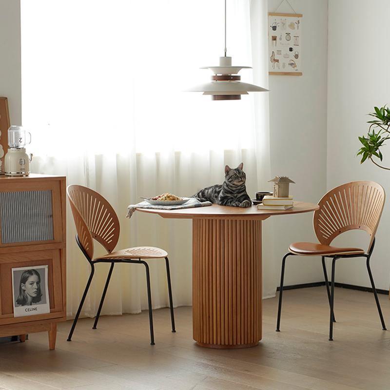 Detail view of Cane Round Dining Table, Oak with narrow dining table