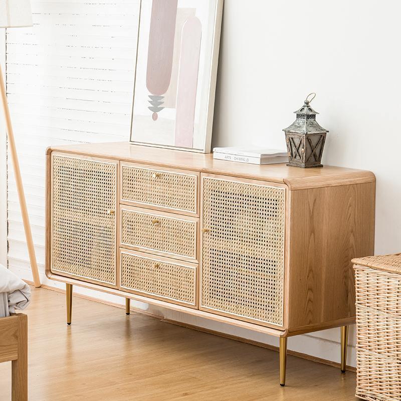 Emmie Sideboard, Natural Rattan & Ash Esche Wood in a lifestyle setting with solid oak sideboard